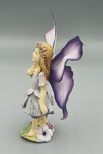 Purple Fairy with Butterfly Wings in the Garden