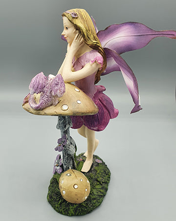 Purple Fairy Resting on Mushroom and Butterfly Wings